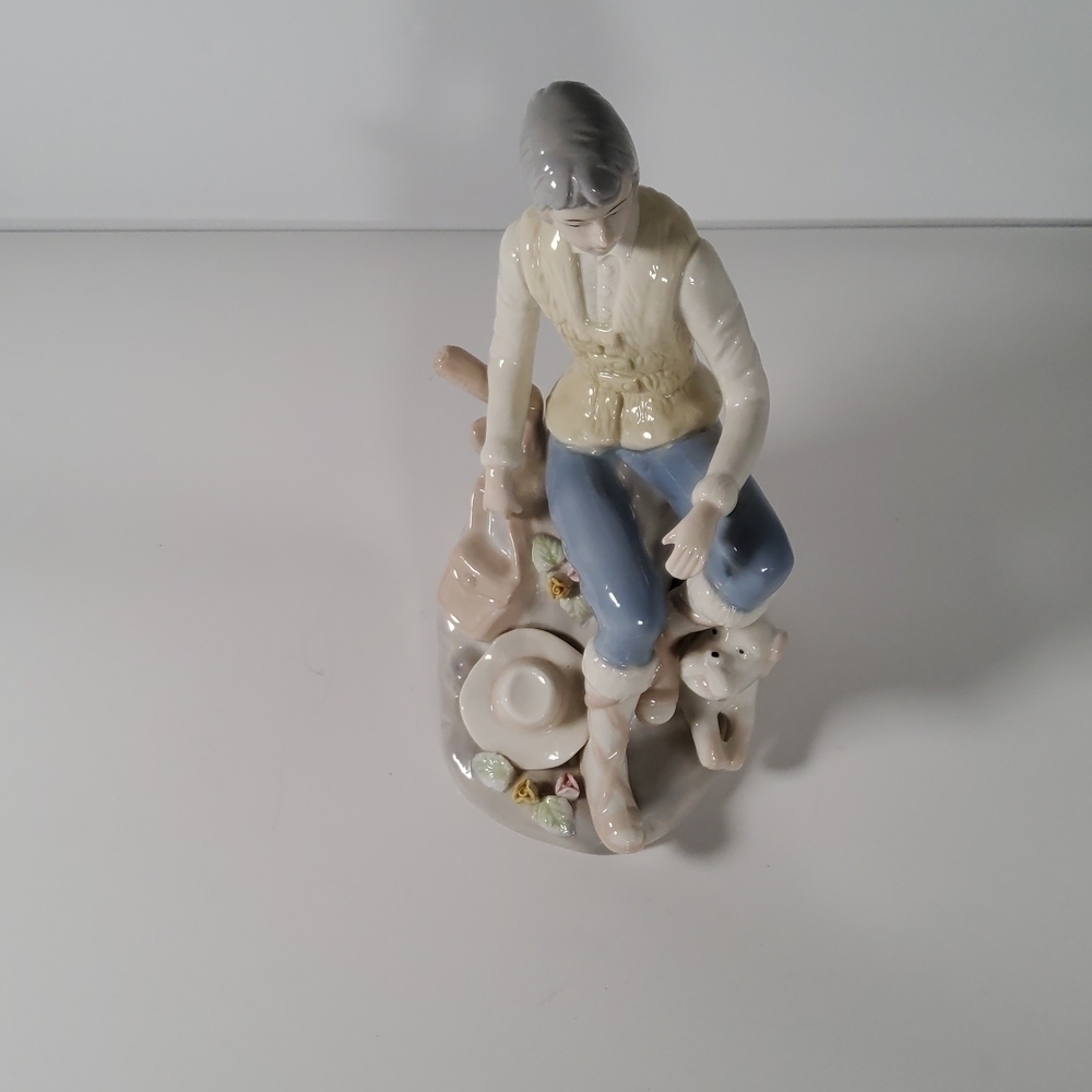 Girl with dog figurine